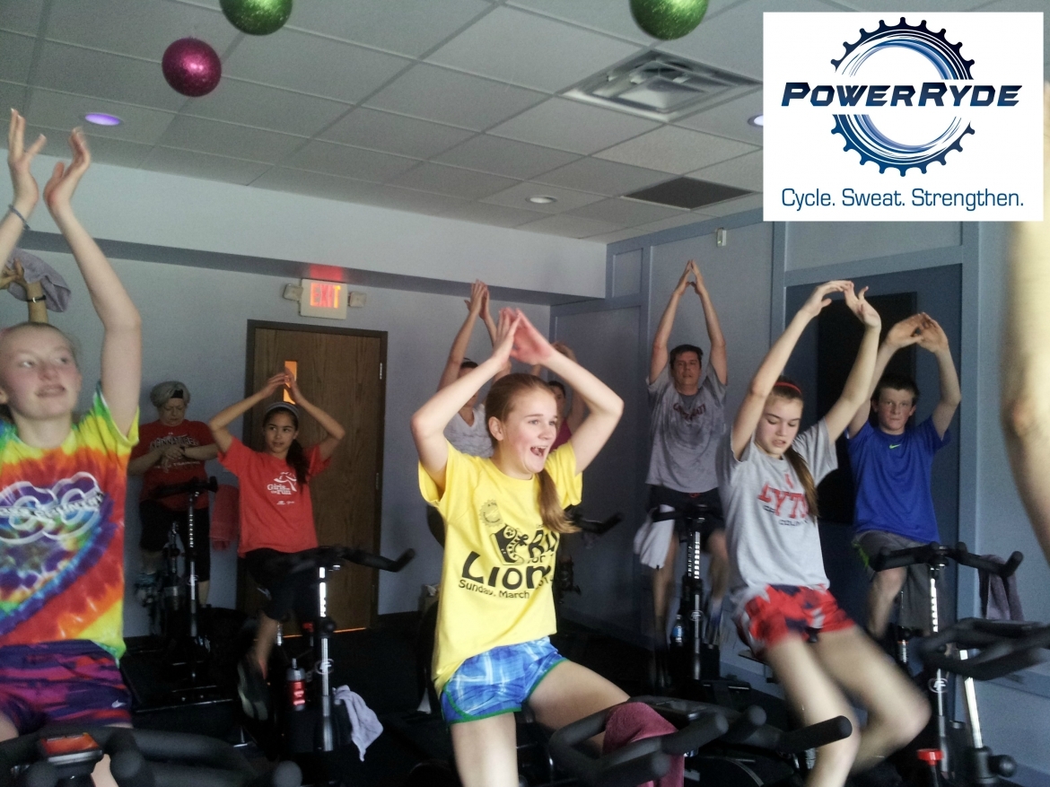 People doing poses with PowerRyde logo